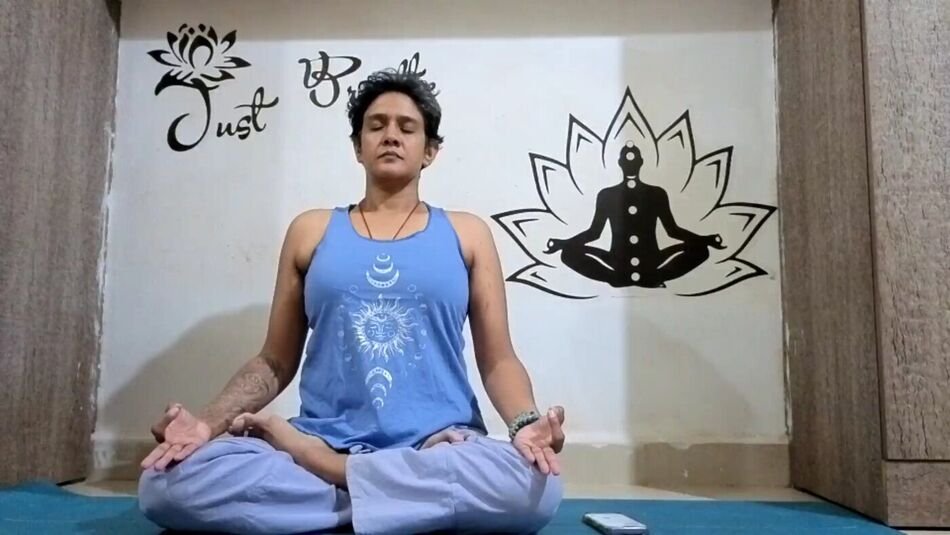 Nitya seated in meditation