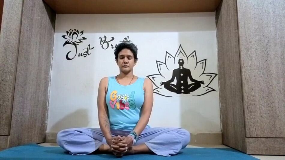 Nitya seated in meditation before class