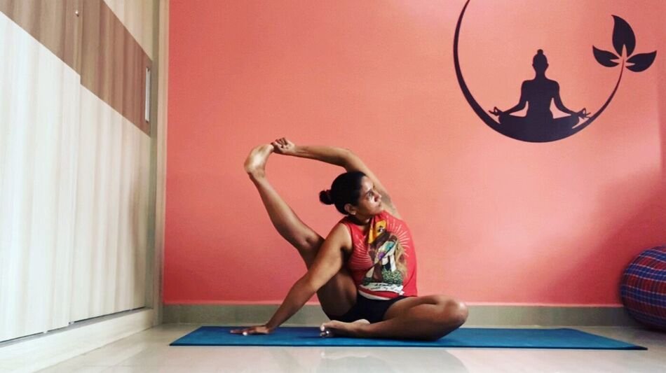 Nitya in Surya Yantrasana, the compass pose