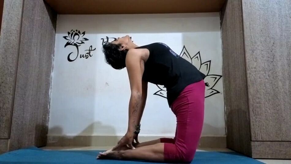 Nitya in Ustrasana, the camel pose